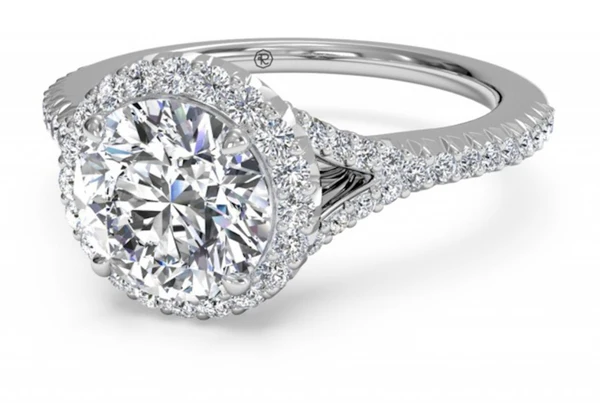 French-set halo engagement ring with a split shank