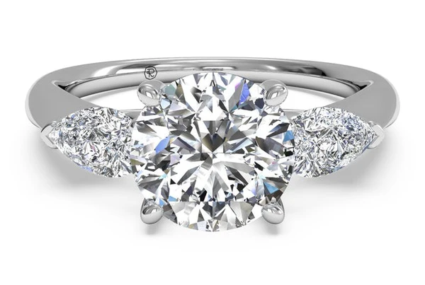 Engagement ring with pear-shaped sidestones