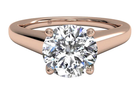 rose gold solitaire engagement ring with a round cut diamond center stone