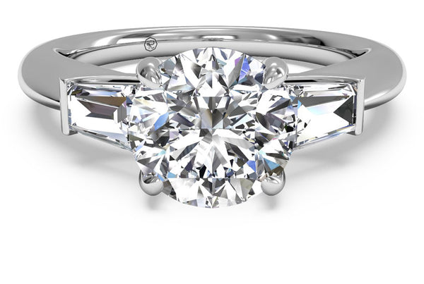 Three stone engagement ring with tapered baguette side stones