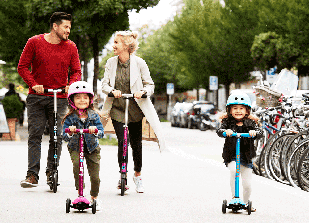 family riding kick scooters