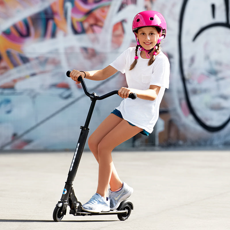 girl riding micro sprite deluxe black kick scooter