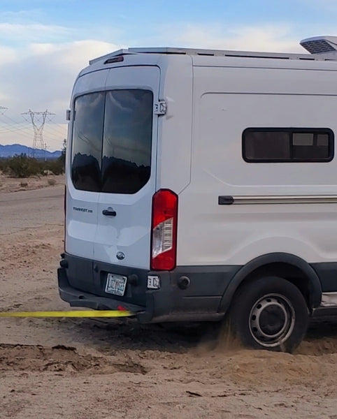 my van getting pulled out of the sand trap in california by a good samaritan (1)