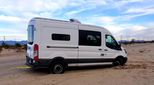 my van getting pulled out of the sand trap in california by a good samaritan (2)