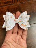 Sparkly white glitter bows with cute carrot and bunny pieces!
