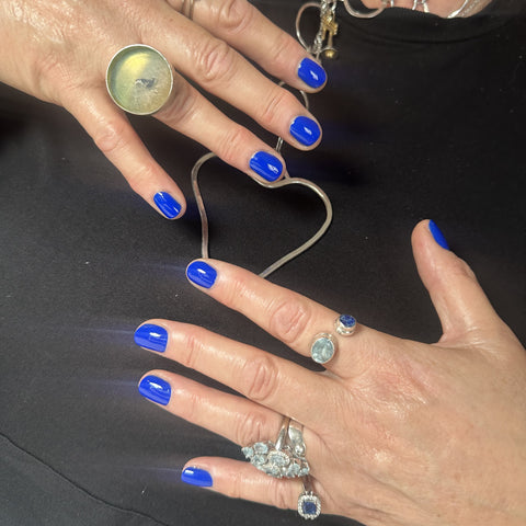 Bright blue manicure and fashion jewellery