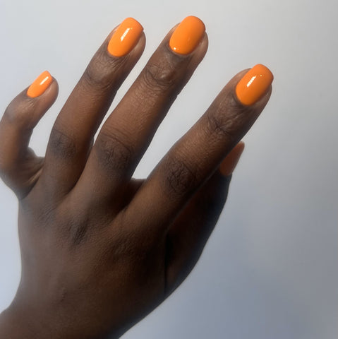 orange manicure dark skin