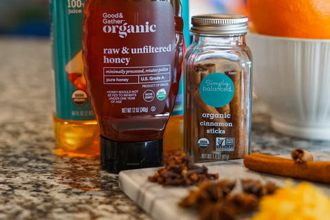 Raw honey, cinnamon, and other ingredients put into mulled wines