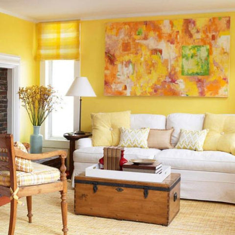 A bold use of yellow in this cheerful living room. The use of neutrals in the furnishings and accessories tones down the palette perfectly. Image: www.lushome.com