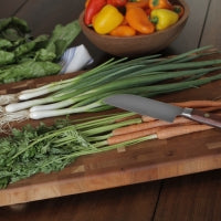 board and knife with vegetables