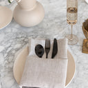 Tabletop setting with natural beige linen napkin