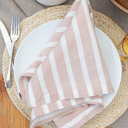 Marisol pink striped napkins sitting on table setting