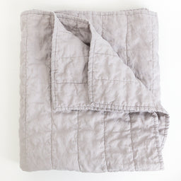Folded classic light grey quilt