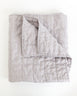 Folded classic light grey quilt