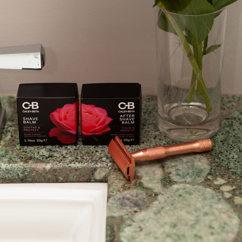 Safety razor displayed with Caley-Beth Shave Balm & After Shave Balm