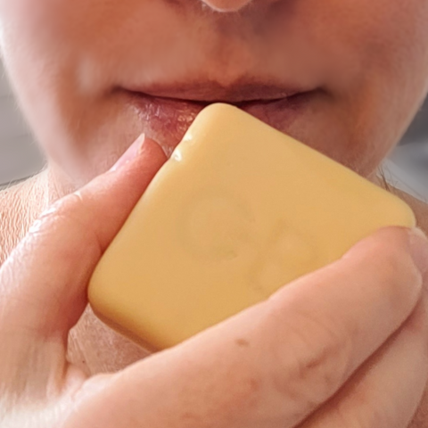 Close up of applying Caley-Beth After Shave Balm as a Lip Balm.