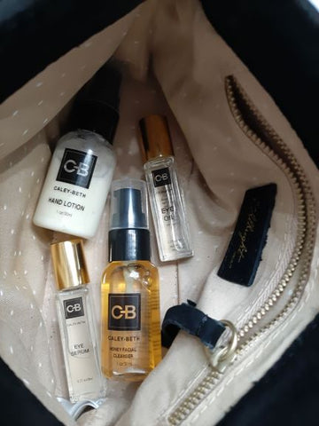 Caley-Beth sustainable skincare.  Toronto, Ontario Canada.  Pocket travel size Caley-Beth Honey Facial Cleanser, Hand and Body Lotion, Eye serum, and Eye Oil inside my purse.