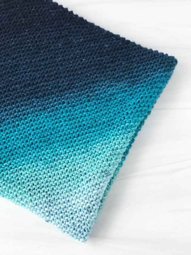 A folded ombre blanket