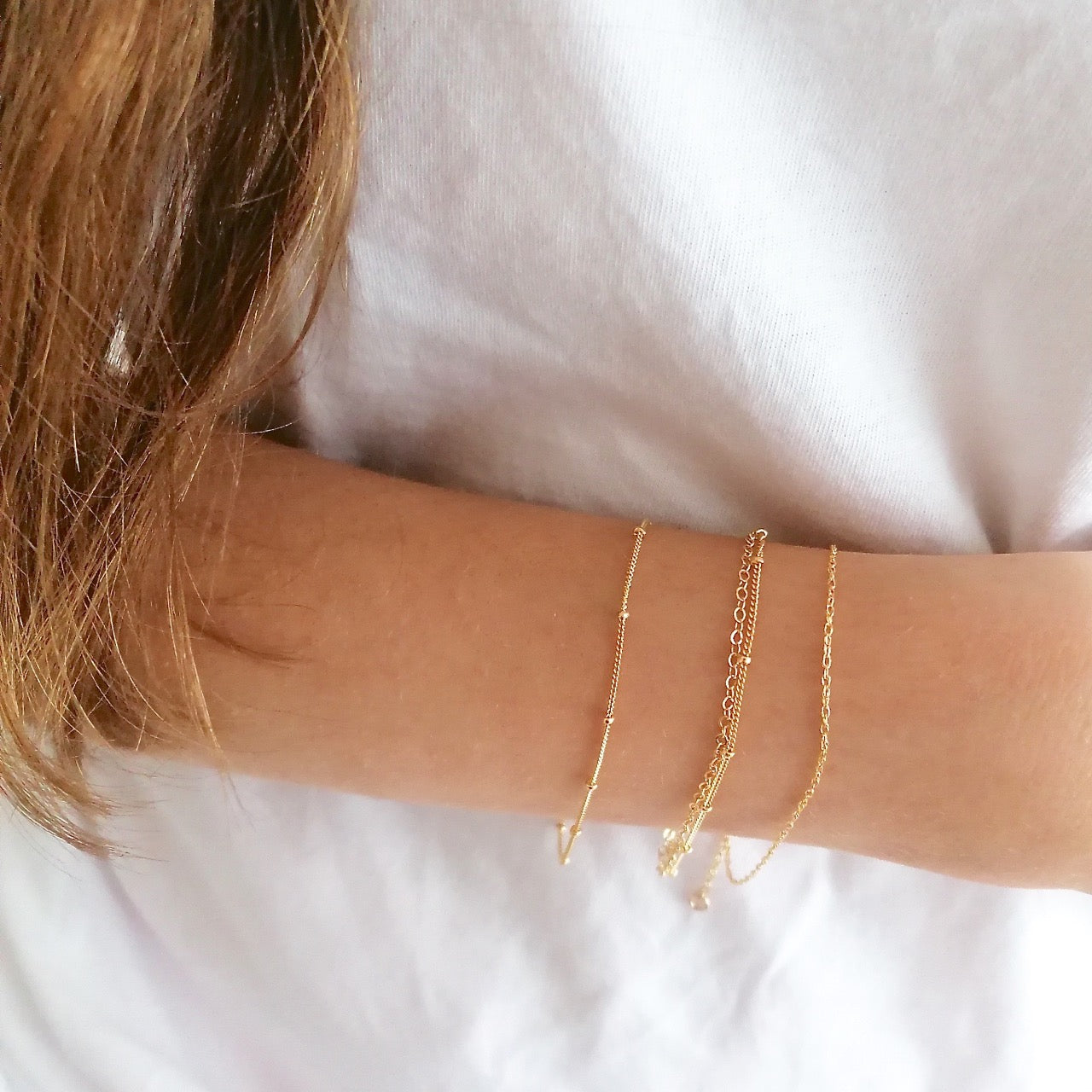 layered bracelets gold