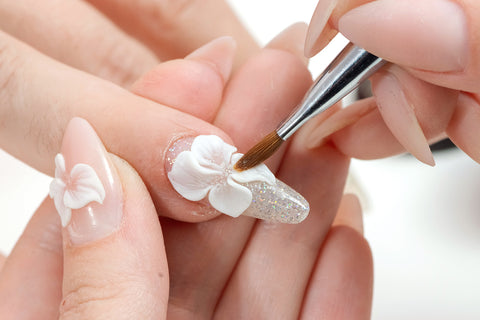 applying acrylic nails