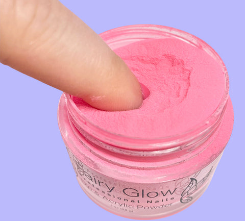 Dipping Fingernail into Pink Dip Powder