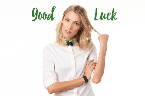 Good Luck butterfly brooch pinned to a white shirt.