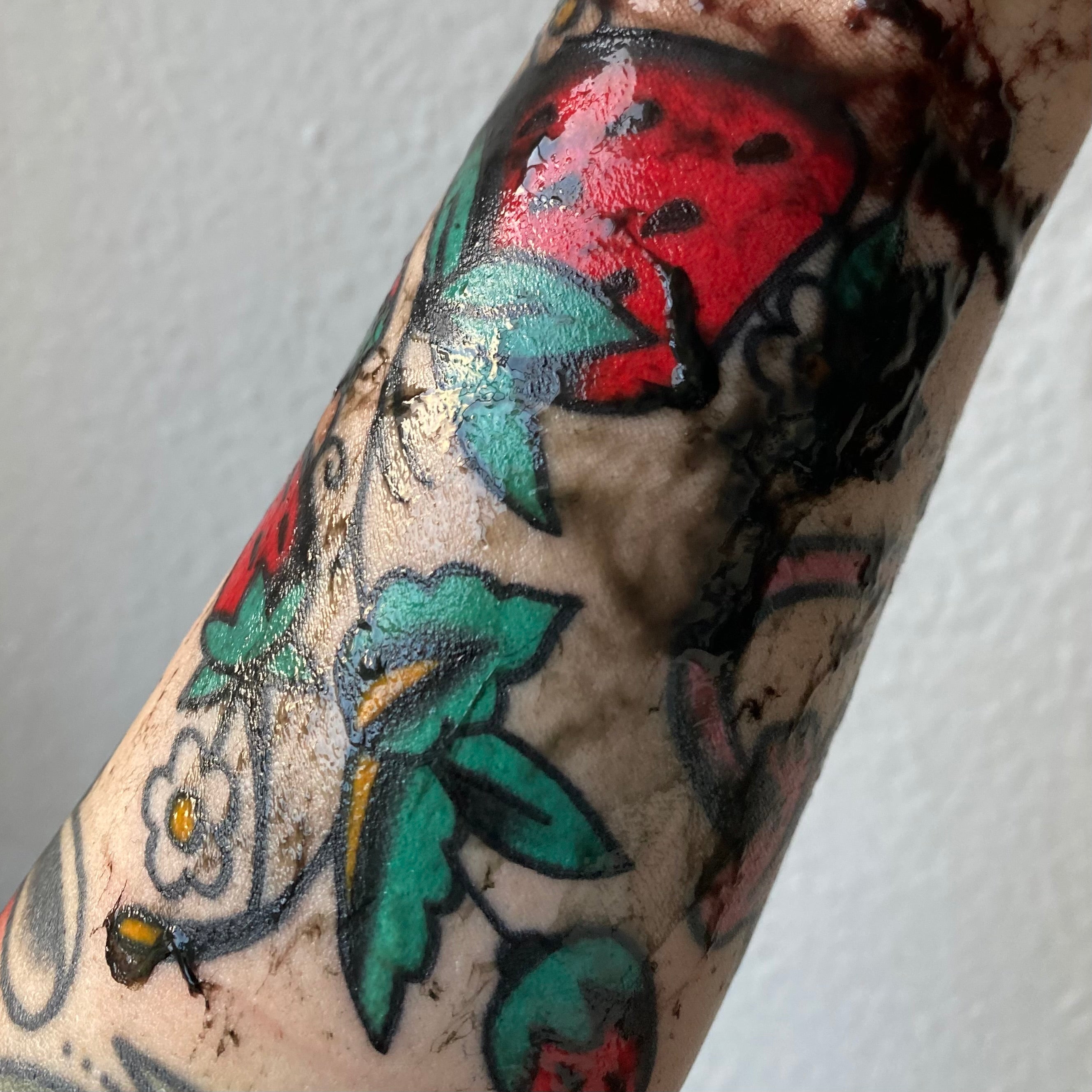 Symptoms of an Infected Tattoo  LoveToKnow Health  Wellness