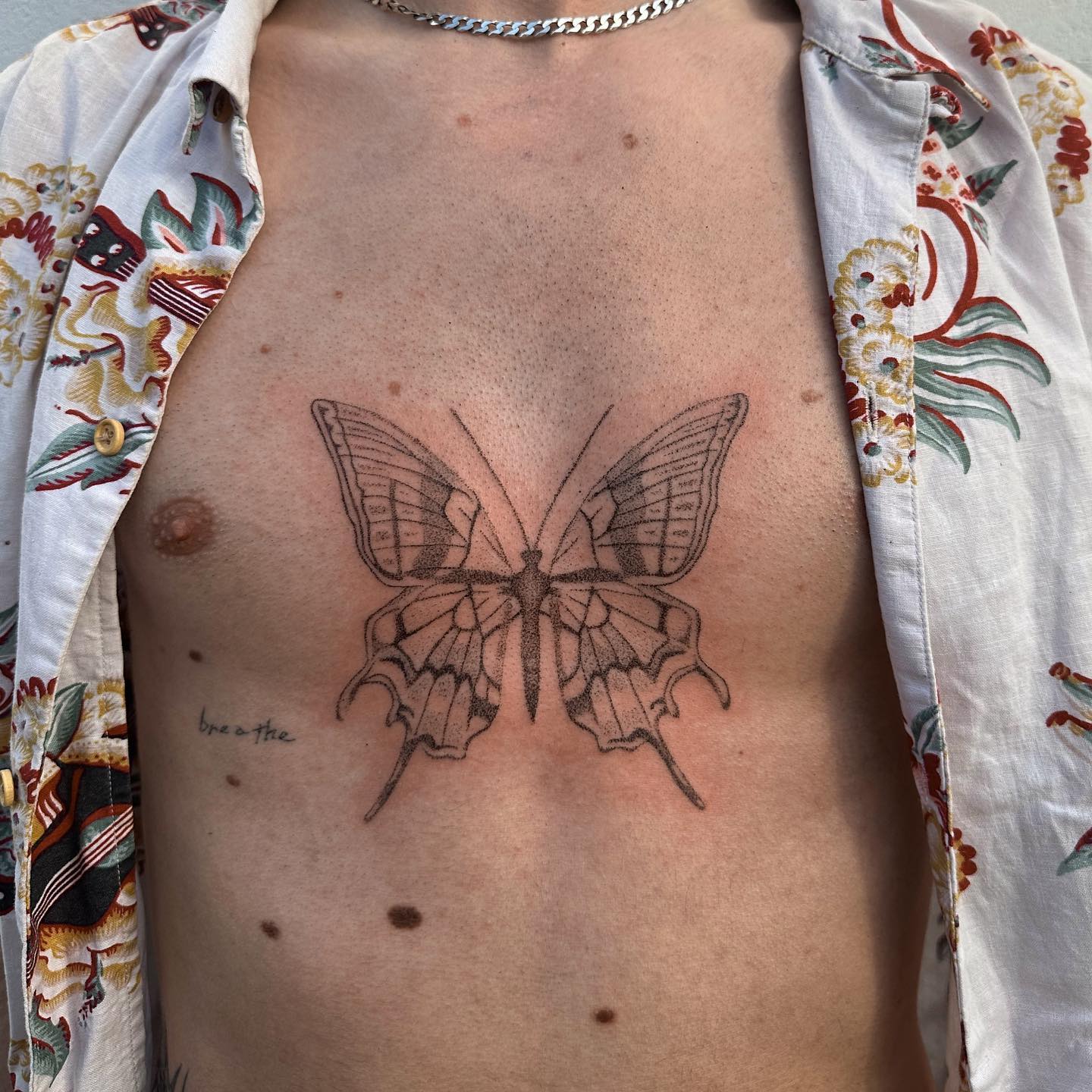 elises poked pieces chest tattoo