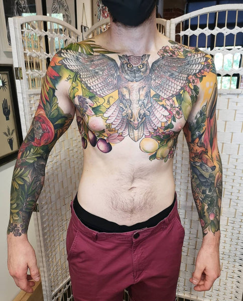 Chest and sleeve tattoos