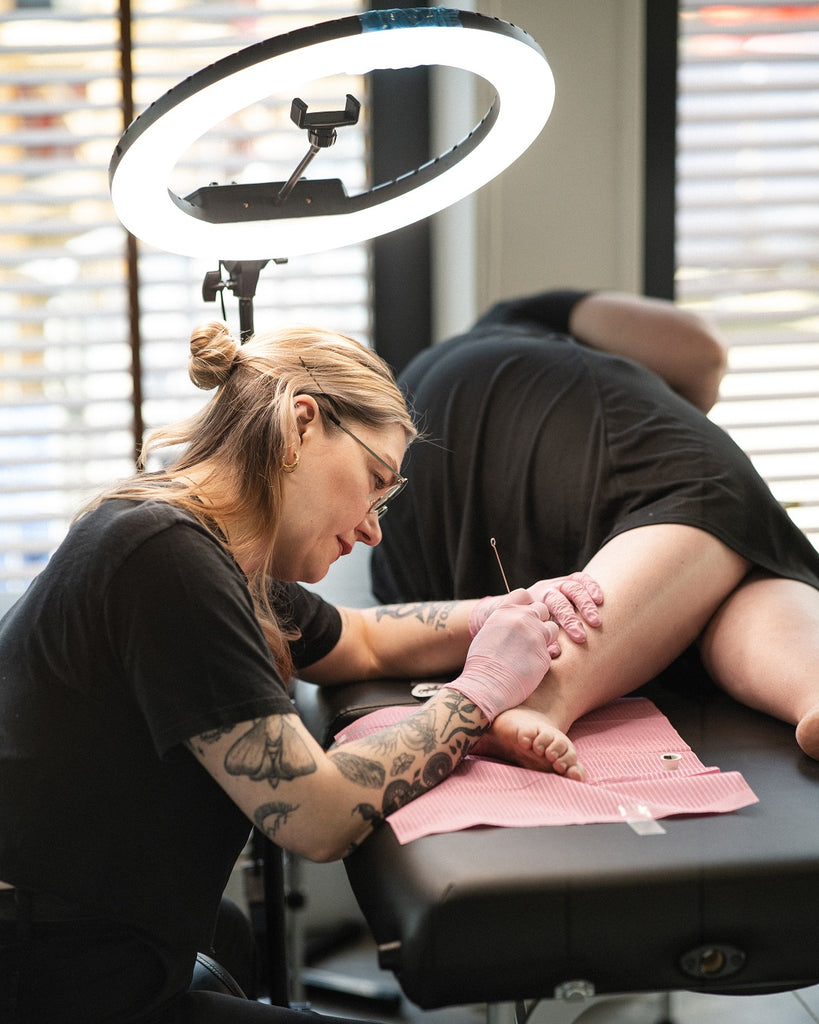 Tattoo artist Ellie Cryer at work