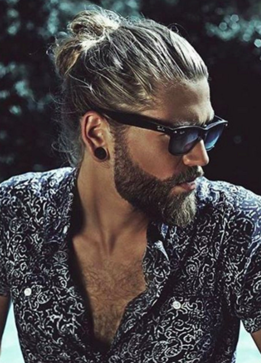 Image of Messy bun hairstyle for oval face with beard