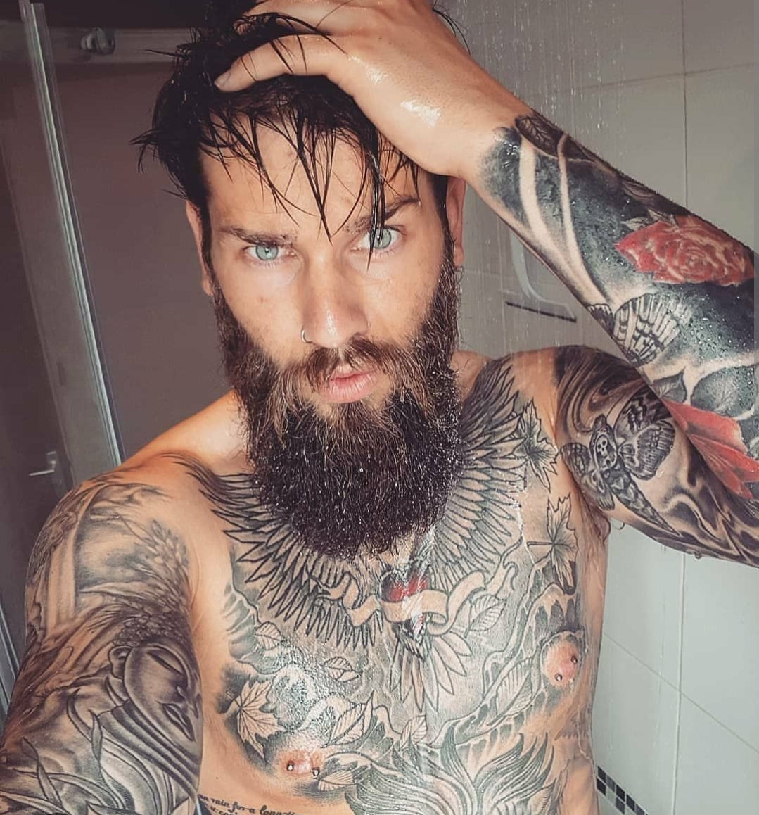 man-with-tattoo-and-beard