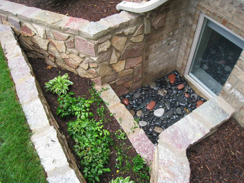 Egress window well opening through garden