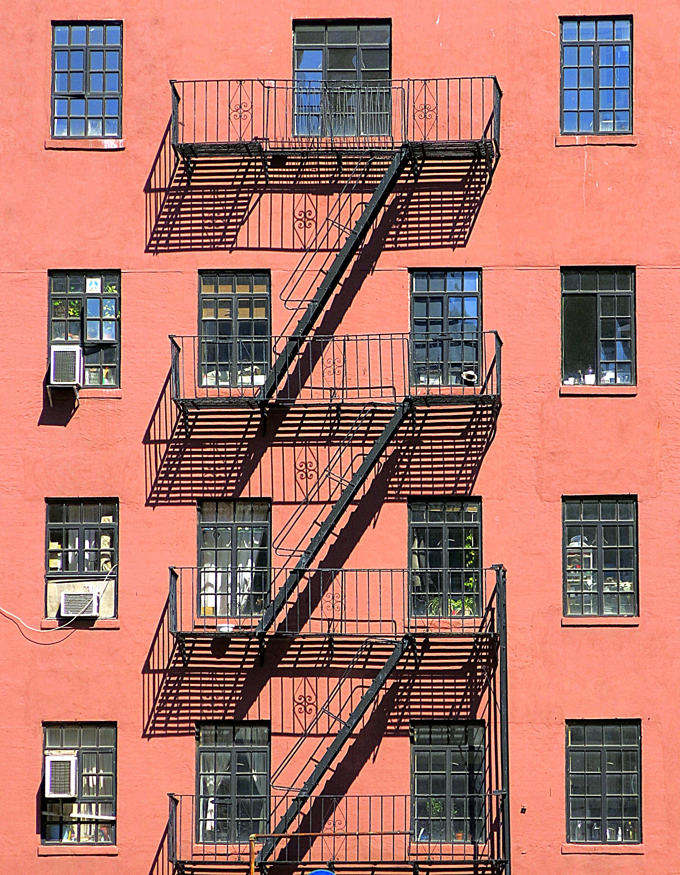 An image of a fire escape on the side of a brick building