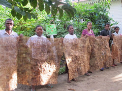 CPALI women standing with completed textile