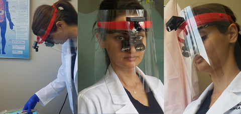 Dentist with our optical loupes attached to a face shield for the safety of your staff!