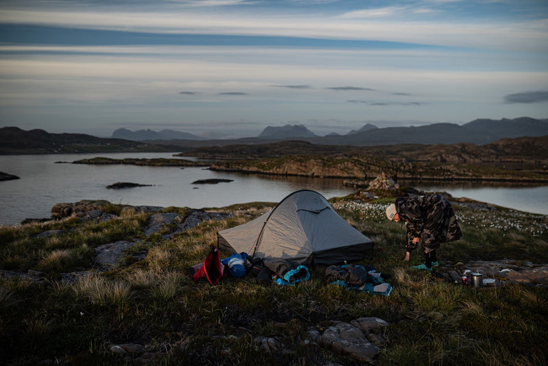 A tent by the sea with Cal Major stood at the side 