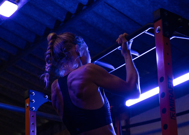 Joanna Shimwell doing pull ups in her gym