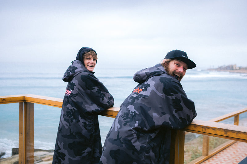 Lukas and Ben Skinner on a balcony in Morocco wearing dryrobe Advance changing robes