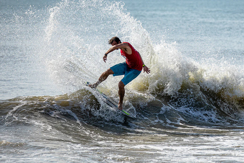 Skimboarder on a wave