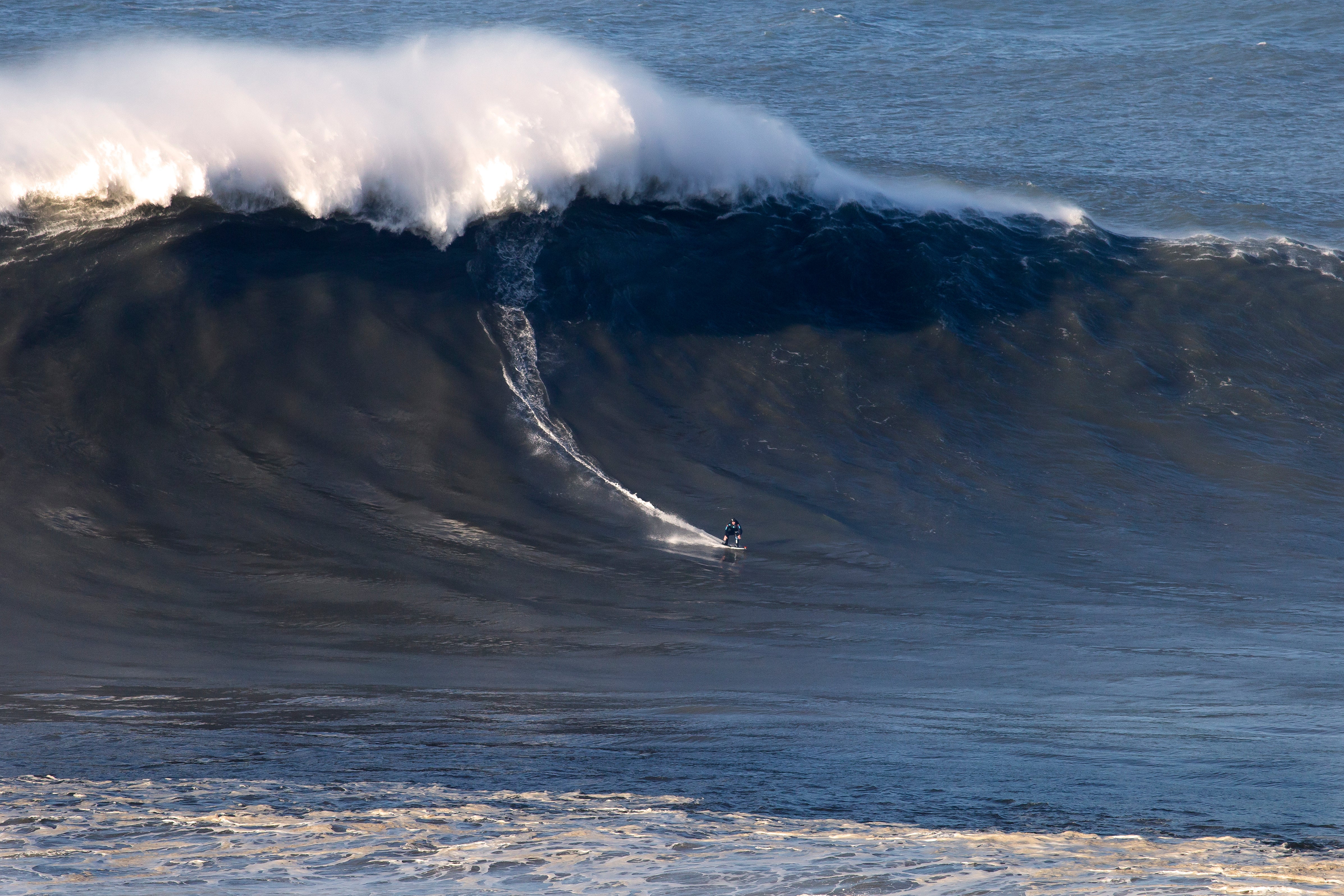 Andrew Cotton surfing at Nazare, Portugal November 2017