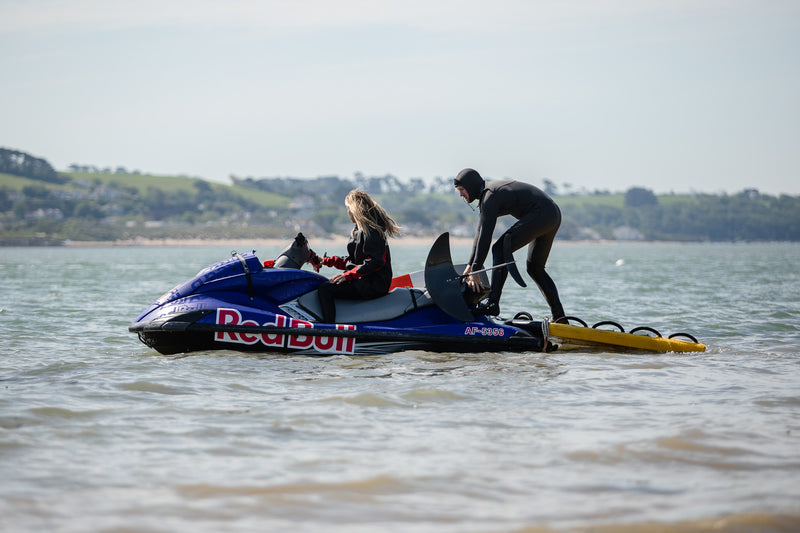 Andrew Cotton on a jet ski on the water ready to go foiling