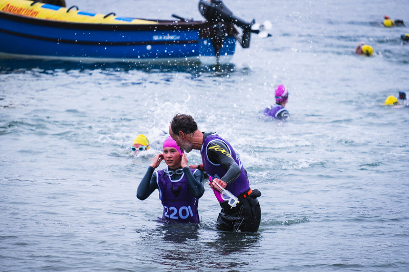 Father and Daughter in the water taking part in a swimrun