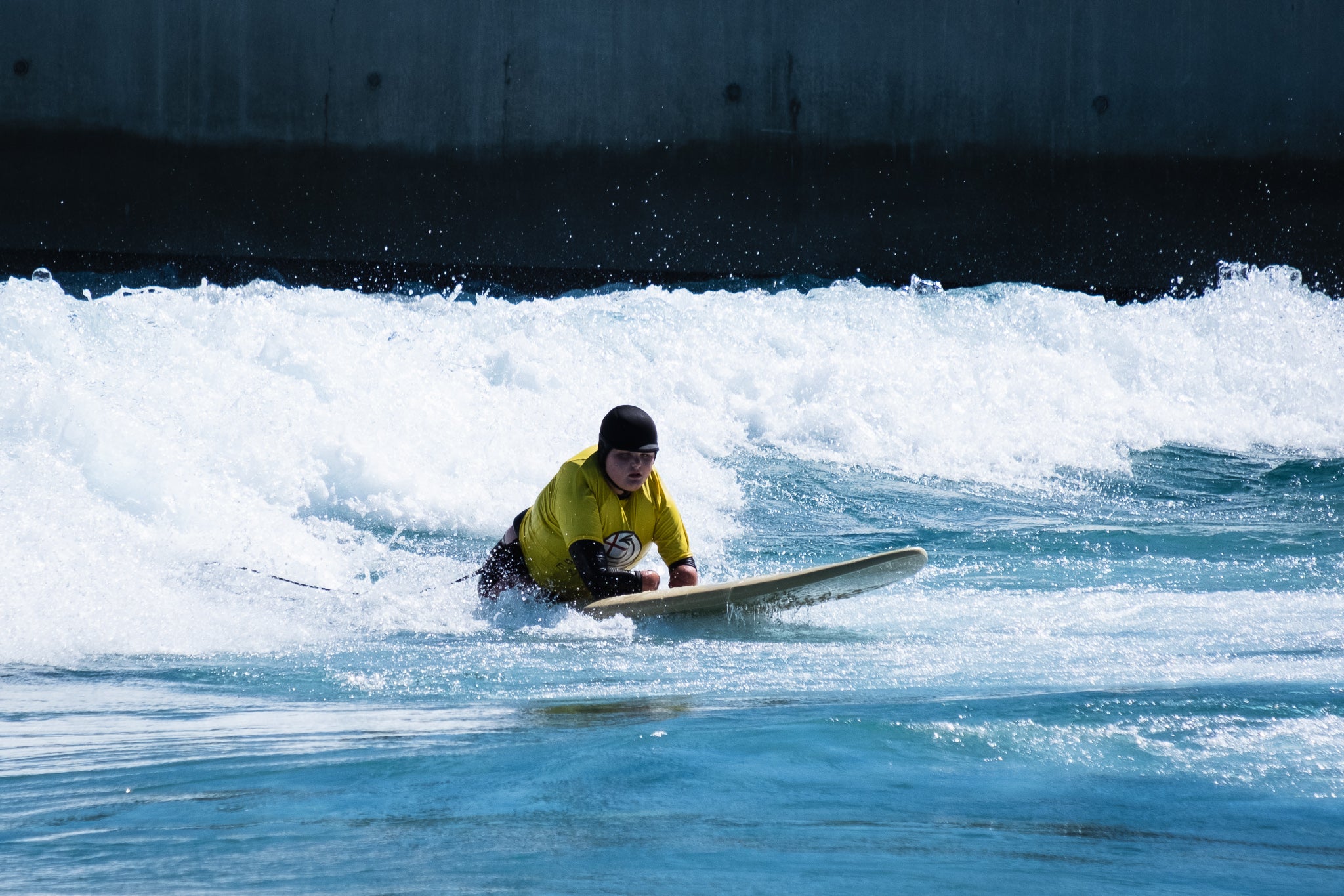 10-year-old, Jade Edward surfing at The Wave in Bristol