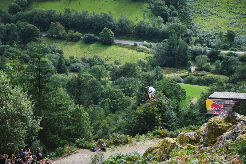 A Red Bull Hardline biker in the air