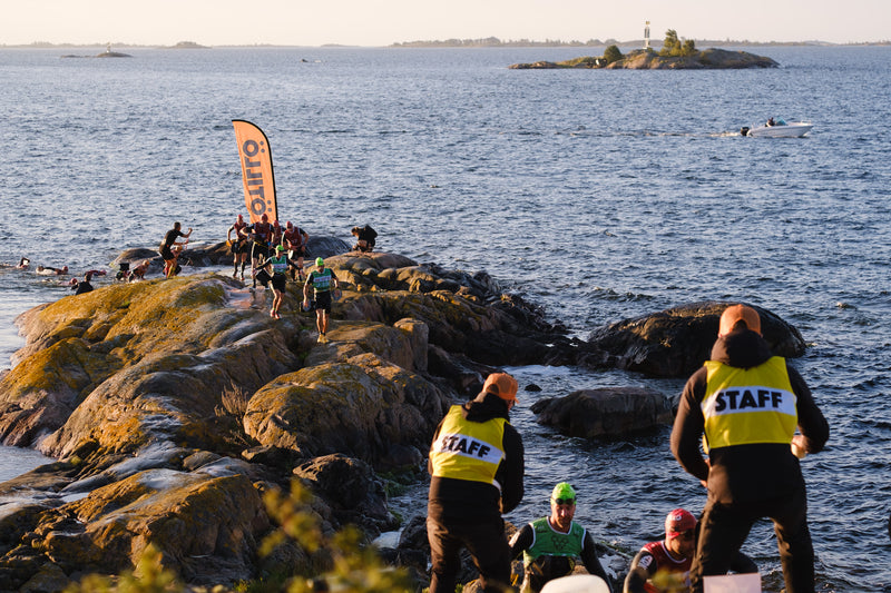 A group of swimrunners coming ashore on an island