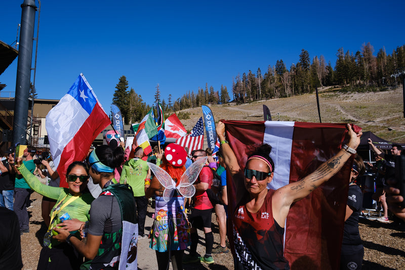 Competitors waving national flags at OCRWC 2023