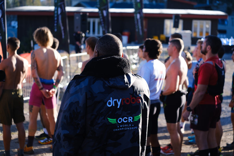 Mr. J'ean wearing an OCRWC dryrobe Advance whilst singing the national anthem at the start line