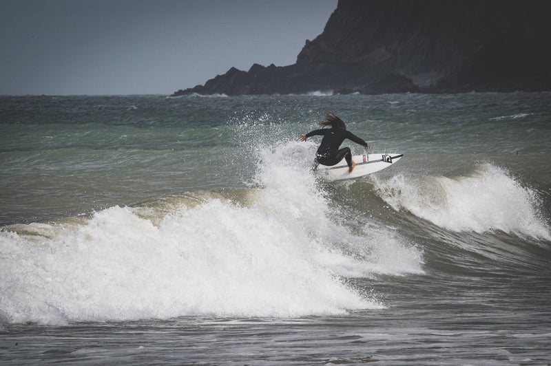 Siyanda Hewitt surfing on a wave