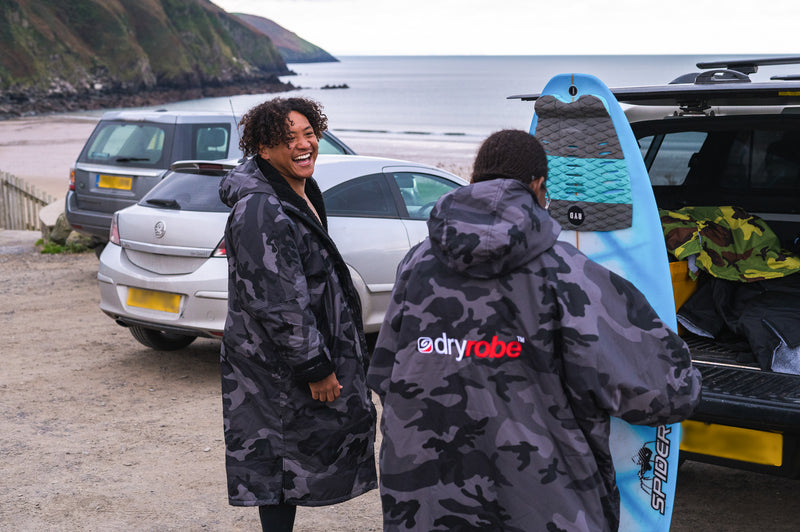 Mini and Sne getting ready to surf on Putsborough beach 